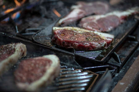 Preparetion of red meat on the grillの写真素材