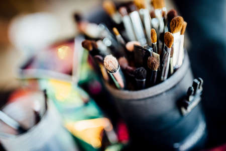 Set of Make up brushes in work for wedding day and happy events. 
Close up colour photo with fine details. Make up, beauty, cosmetics, face care, weddings, woman related,の写真素材