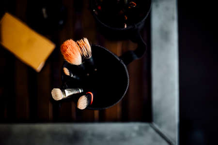 Set of Make up brushes in work for wedding day and happy events. 
Close up colour photo with fine details. Make up, beauty, cosmetics, face care, weddings, woman related,の写真素材
