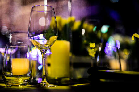 Luxury table settings for fine dining with and glassware, beautiful blurred  background. For events,...