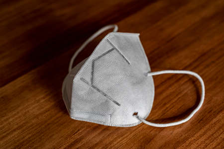 New age everyday carry mask keys and wallets. Covid - 19, corona, mask, n-95, new era, virus, global epidemic, outbreak, face maskの写真素材