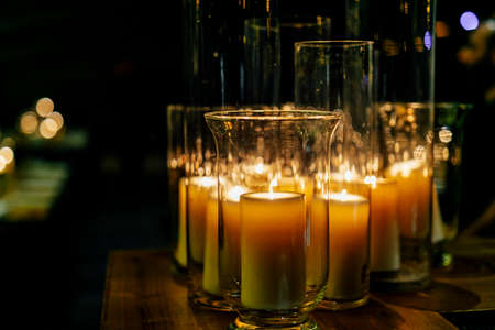 Luxury table settings for fine dining with and glassware, pouring wine to glass. Beautiful blurred background. Preparation for holiday wedding. Fancy luxury restaurant.の写真素材