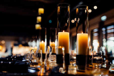 Burning candles in a restaurant. Selective focus on candles.の写真素材