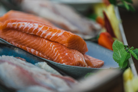 This captivating stock photography encapsulates the art of fish and meat preparation in an enchanting outdoor kitchen setting.の写真素材