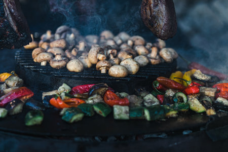 This captivating stock photography encapsulates the art of fish and meat preparation in an enchanting outdoor kitchen setting.の写真素材