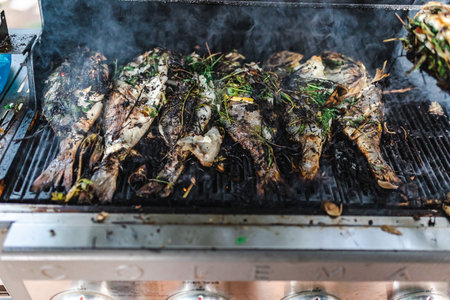 This captivating stock photography encapsulates the art of fish and meat preparation in an...