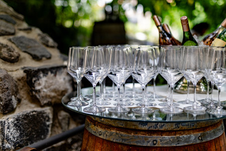 WINE AND cocktail glasses in beutiful light and table settings.
