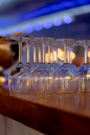 WINE AND cocktail glasses in beutiful light and table settings.