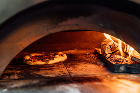 Baking and serving pitta brad, pizza and fresh bread in dinner restaurant and social events.の写真素材