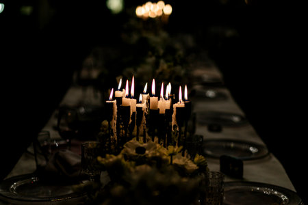 Luxury table settings for fine dining with and glassware, pouring wine to glass. Beautiful blurred...