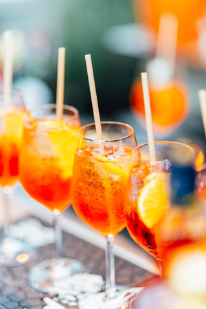 An elegant table setting with cutlery, wine glasses, and white napkins, illuminated by soft natural light. Perfect for interior design, events, or hospitality concepts.の写真素材