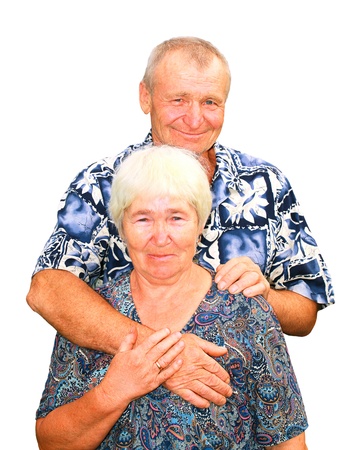 Smiling senior couple embracing izolatedの写真素材