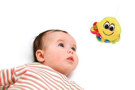 Beautiful baby keep an eye on the octopus toyの写真素材