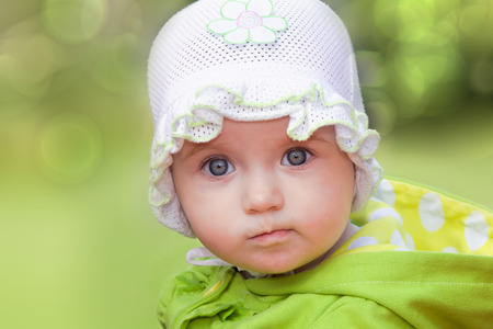 Funny baby girl looking in wide-eyed astonishmentの写真素材