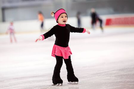 Beautiful girl learns to skateの写真素材