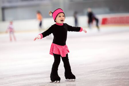 Beautiful girl learns to skate