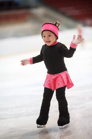 Funny girl learns to skateの写真素材