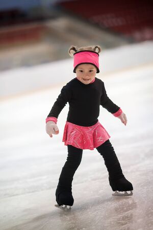 funny little girl is skatingの写真素材