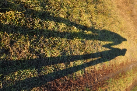 boy and girl walking on the way of autumnの写真素材