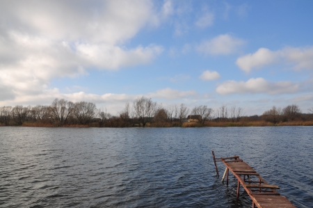 Bridge on the River in windy weather in rural areasの写真素材