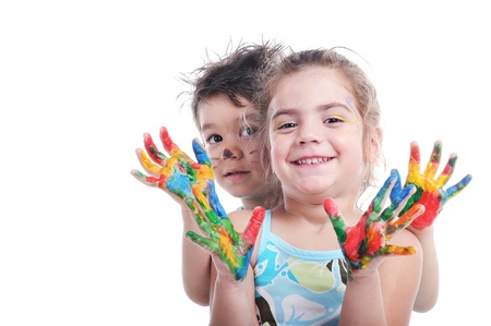 Smiley preschooler boy and girl showing their painted hands の写真素材