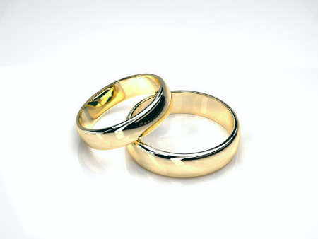 two gold wedding rings isolated on white background. yellow and white goldの写真素材