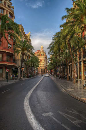 deserted city streets at lunchtime, palm trees and clear blue skyのeditorial素材
