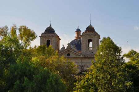 beautiful medieval castle in the backdrop of the serene blue of the sky, the trees in the foregroundのeditorial素材