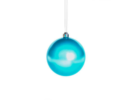 colorful Christmas balls, green, red, blue hanging by a thread of goldの写真素材