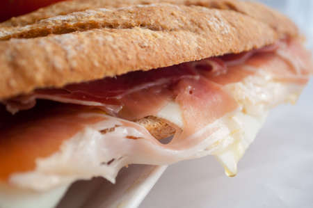 traditional Spanish sandwich with ham and cheese, delicious, fresh, diet, with lettuce, on a white background. Spanish bocadillo whis jamon and quesoの写真素材