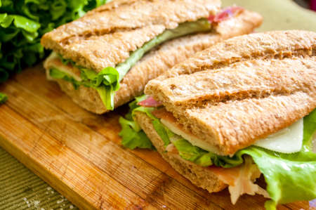 traditional Spanish sandwich with ham and cheese, delicious, fresh, diet, with lettuce bocadillo con jamon y quesoの写真素材