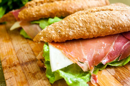 traditional Spanish sandwich with ham and cheese, delicious, fresh, diet, with lettuce bocadillo con jamon y quesoの写真素材