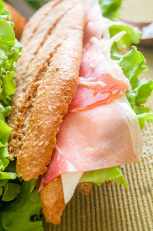 traditional Spanish sandwich with ham and cheese, delicious, fresh, diet, with lettuce bocadillo con jamon y quesoの写真素材
