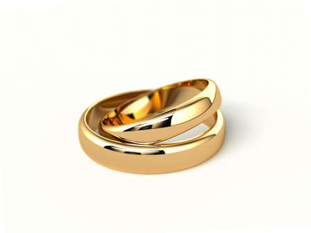 two gold wedding rings isolated on white background