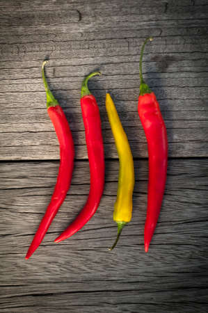 hot chili peppers avetrana on the old wooden table closeupの写真素材