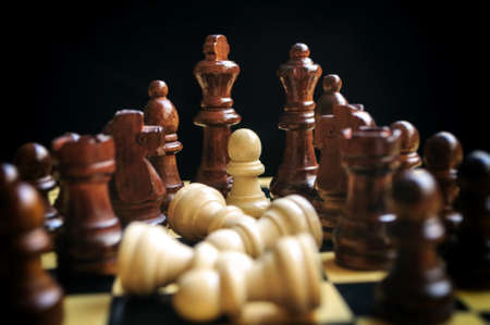 chess black and white pieces on the wooden Boardの写真素材