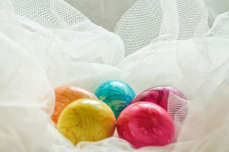 colored, painted eggs on a white background for Easterの写真素材