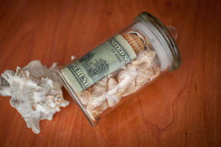 money in the jars on the table, savings for vacationの写真素材