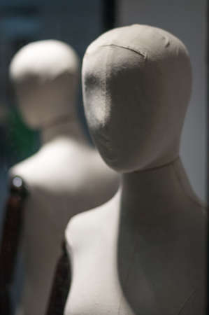 naked female mannequin in a store windowの写真素材