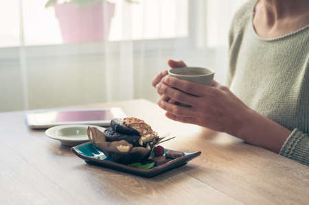 Delicious chocolate muffin with chocolate chips and fresh coffee for Breakfast best way to start the morning.の写真素材