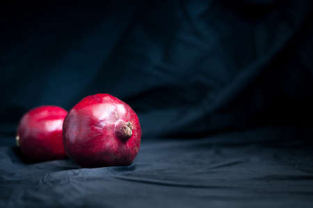 fresh pomegranate on a black backgroundの写真素材