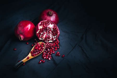 fresh pomegranate on a black backgroundの写真素材