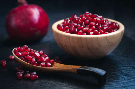 fresh pomegranate on a black backgroundの写真素材