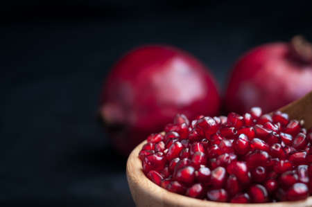 fresh pomegranate on a black background