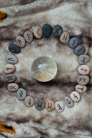 Futark stone runes handmade on the furの写真素材