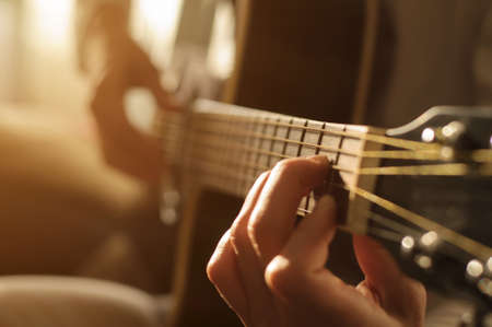 playing acoustic guitar