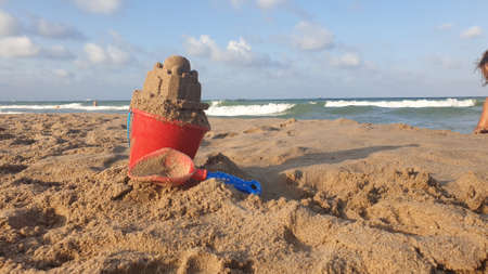 Sand castle made by a child on the beach.