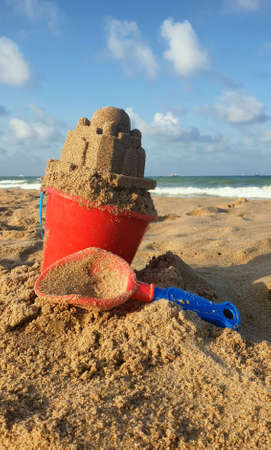 Sand castle made by a child on the beach.の写真素材