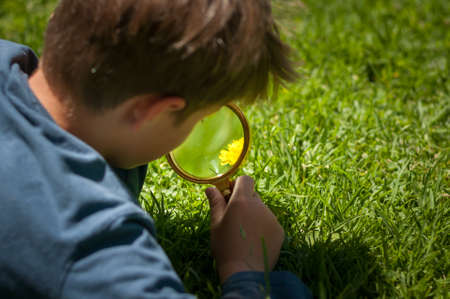 boy the Explorer of nature with magnifying glassの写真素材