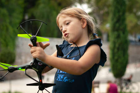 little girl in the Park launches dronesの写真素材